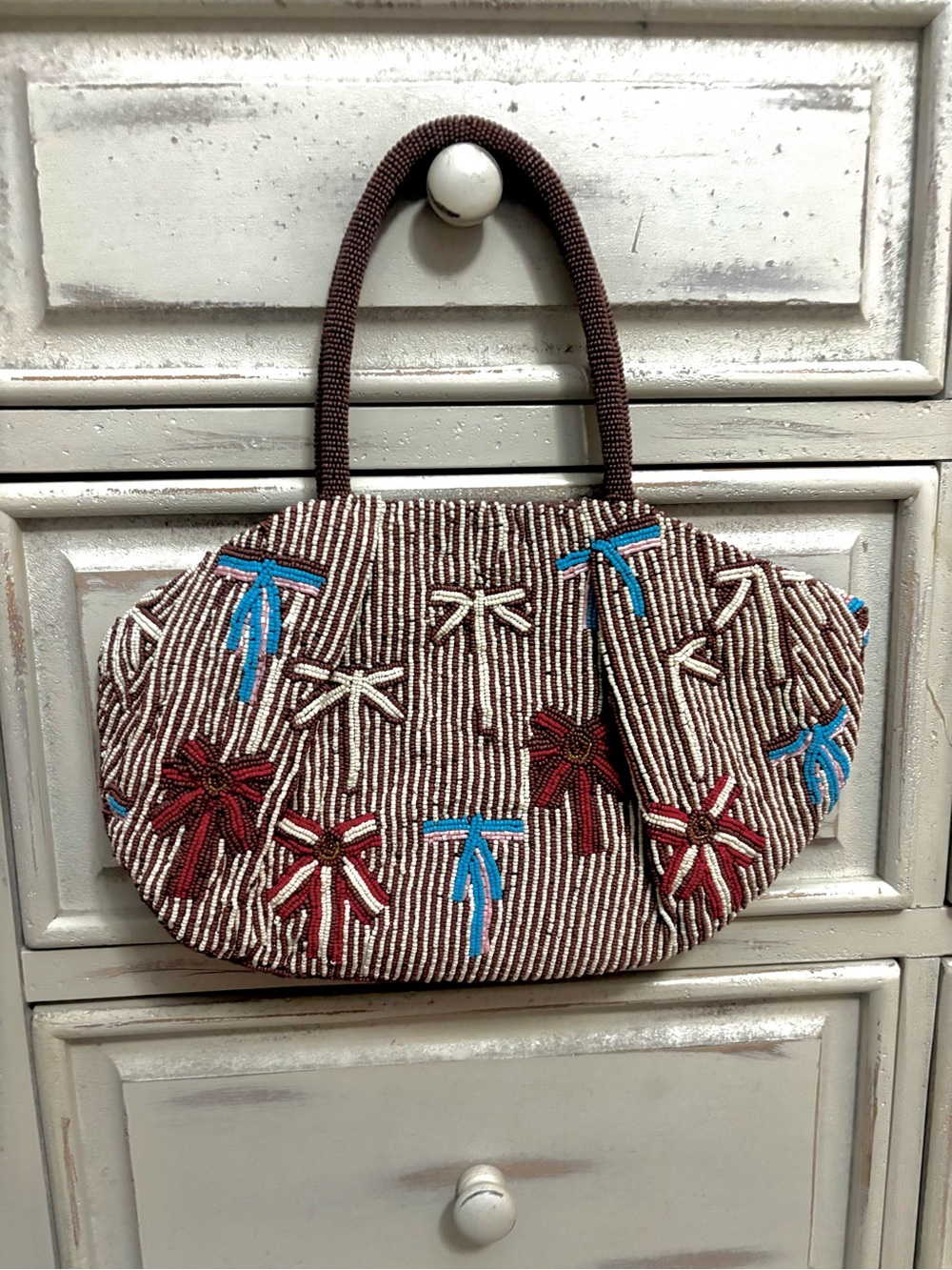 Anthropologie Handcrafted Brown Beaded Tote with Multicolor Bow Accents.